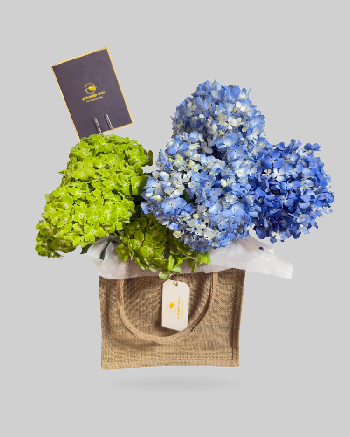 Emerald Green and Blue Hydrangea Jute Bag Arrangement