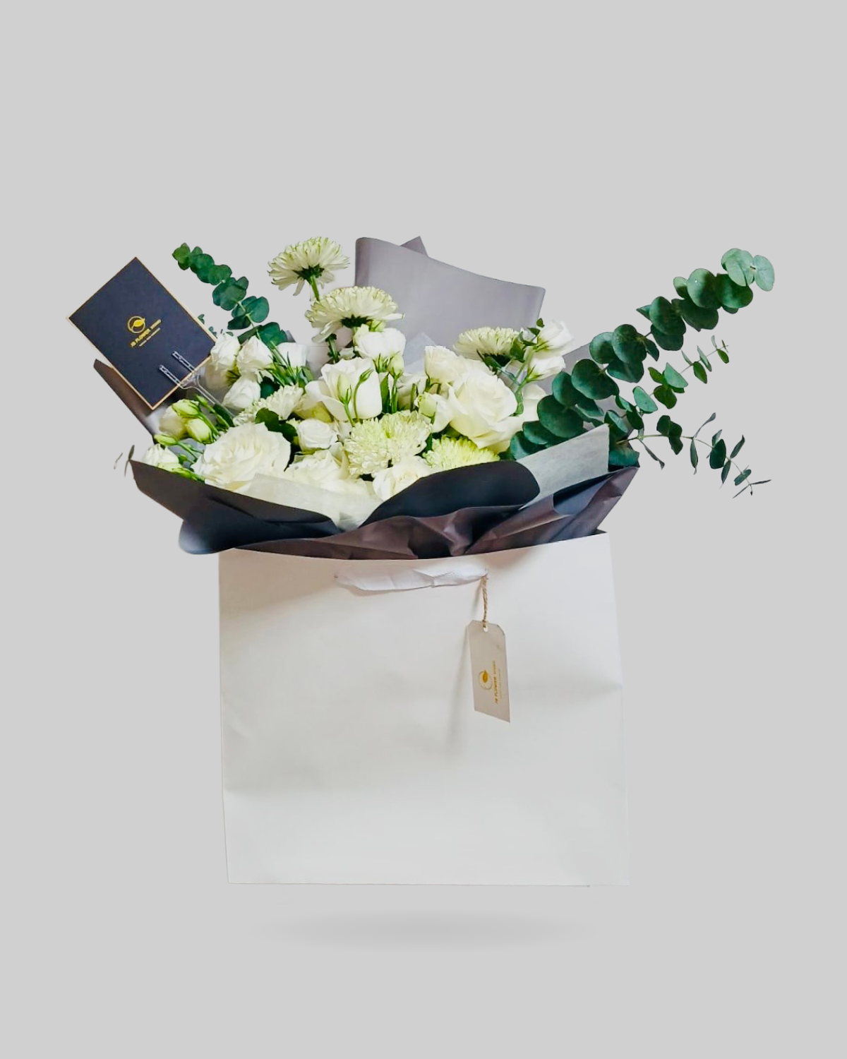 Elegant White Mixed Floral Paper Bag Arrangement