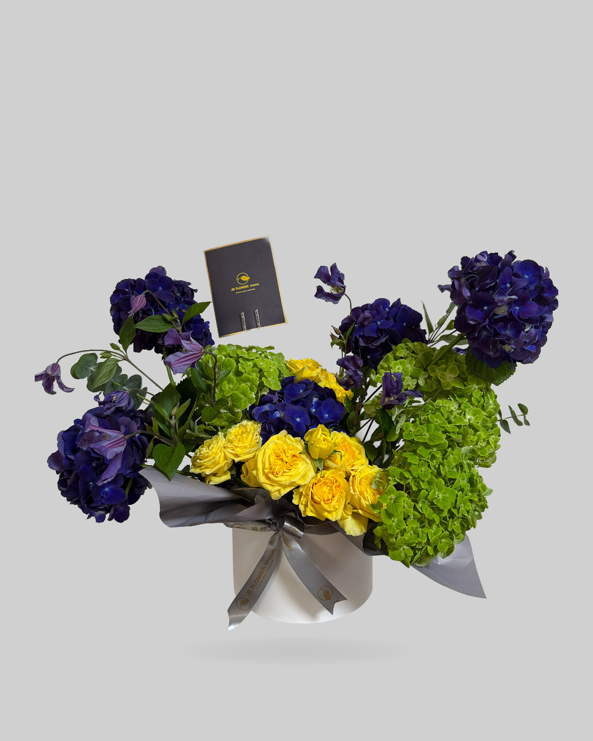 Elegant Green, Yellow, and Blue Hydrangea Round Box Arrangement