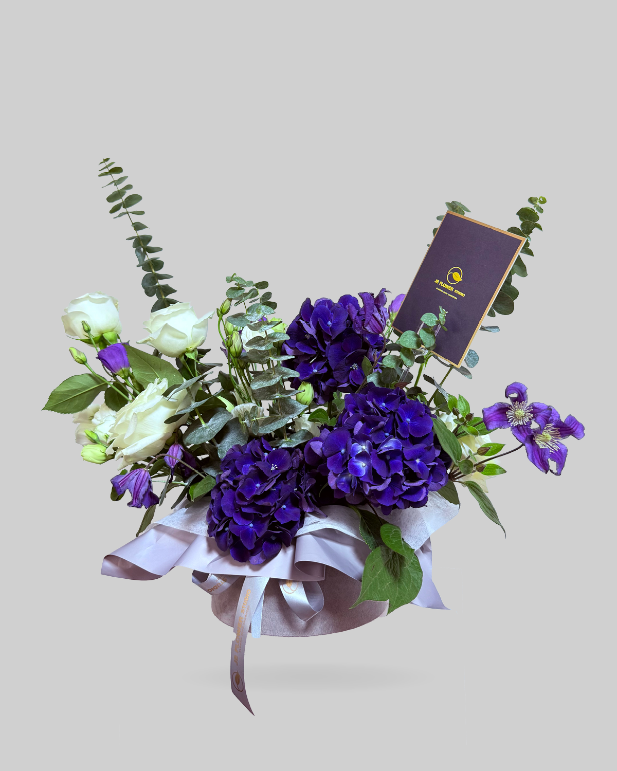 Lush Purple and White Mixed Floral Round Box Arrangement