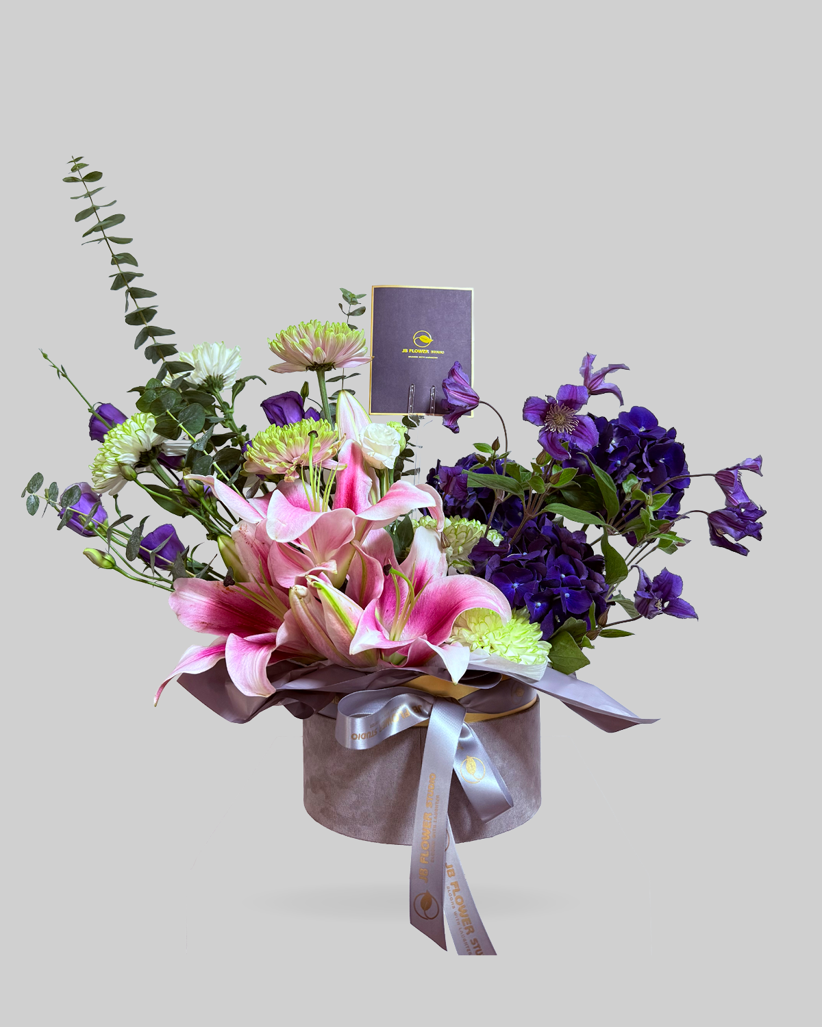 Enchanting Purple and Pink Mixed Floral Round Box Arrangement
